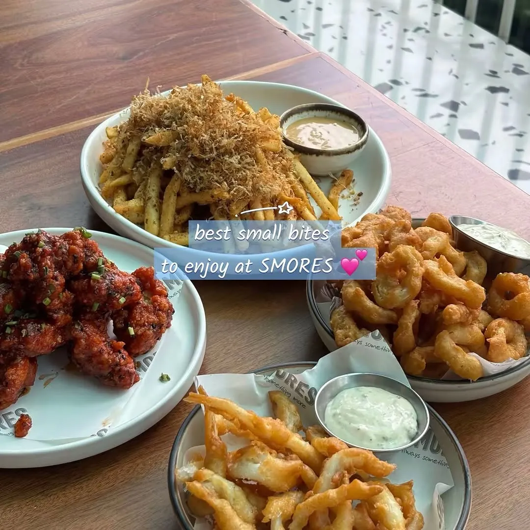 Platter of Korean Fried Chicken, Umami Fries, and Deep Fried Calamari.