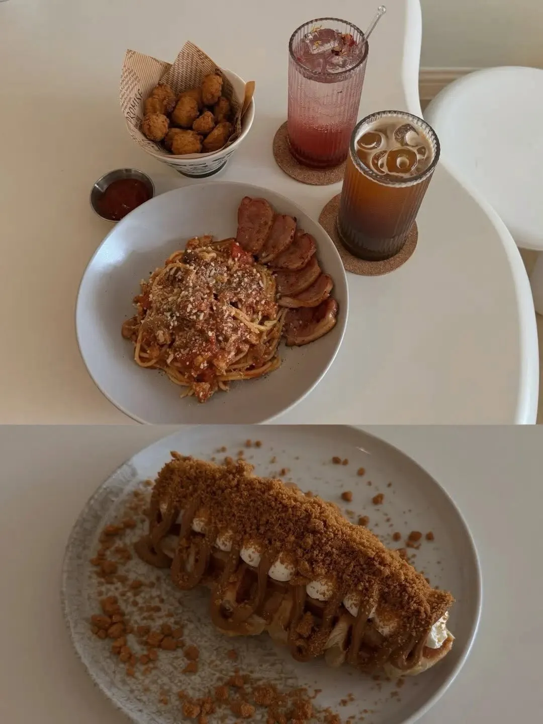 Delicious pasta and drinks on a white table with snacks