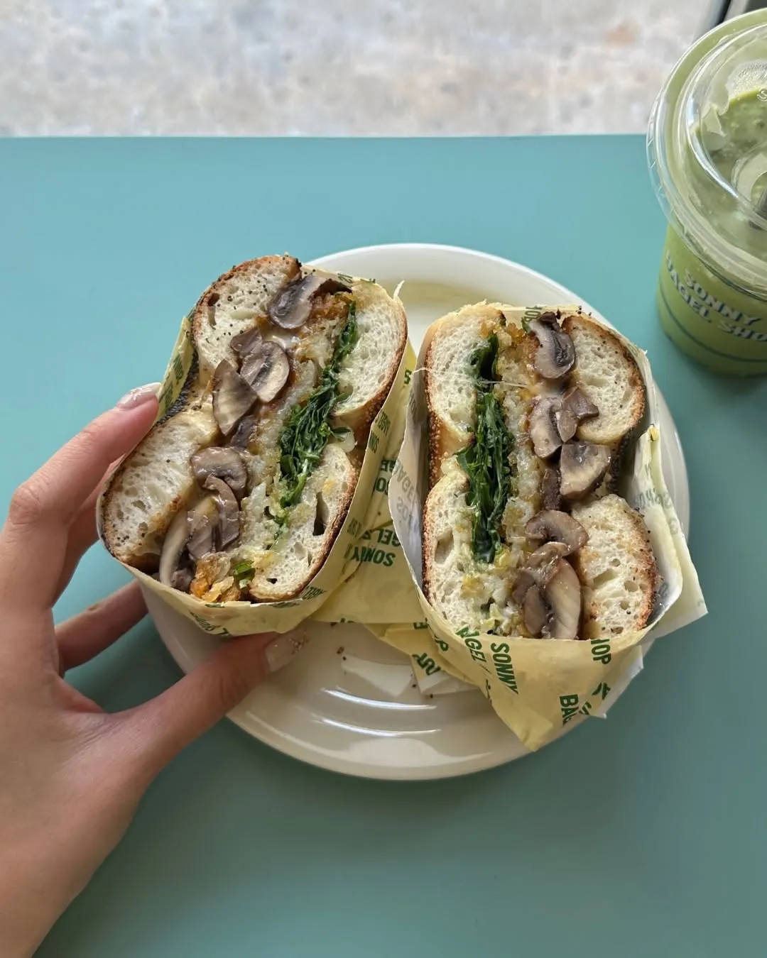 Hand-rolled woodfired bagels displayed on a tray, ready for customers.