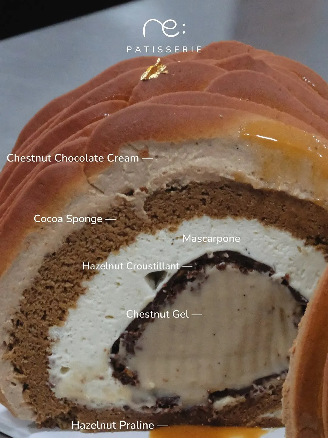 Cross-section of Swiss Roll revealing layers of chestnut chocolate cream and mascarpone.
