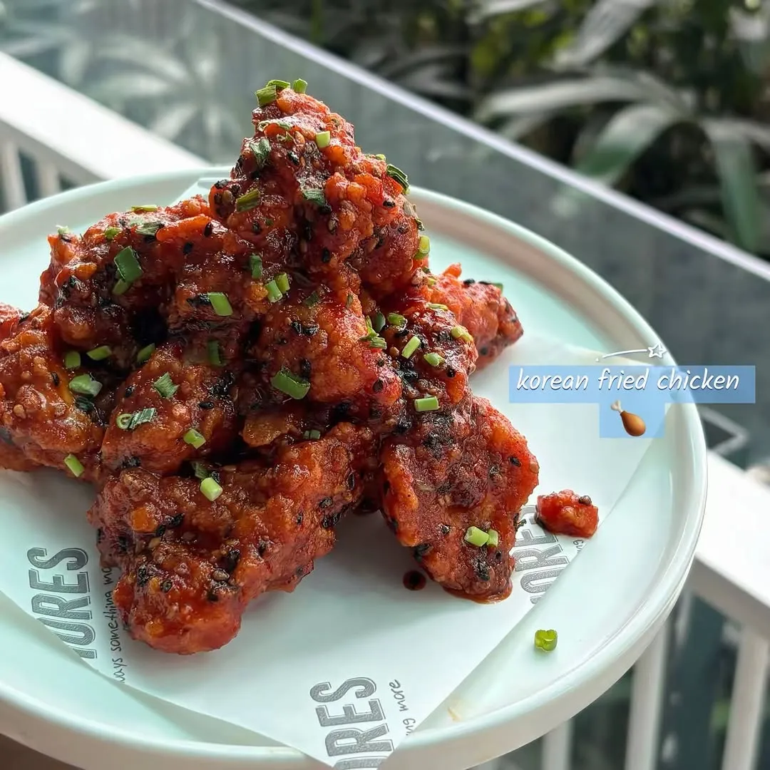 Close-up of crispy Korean Fried Chicken on a plate.