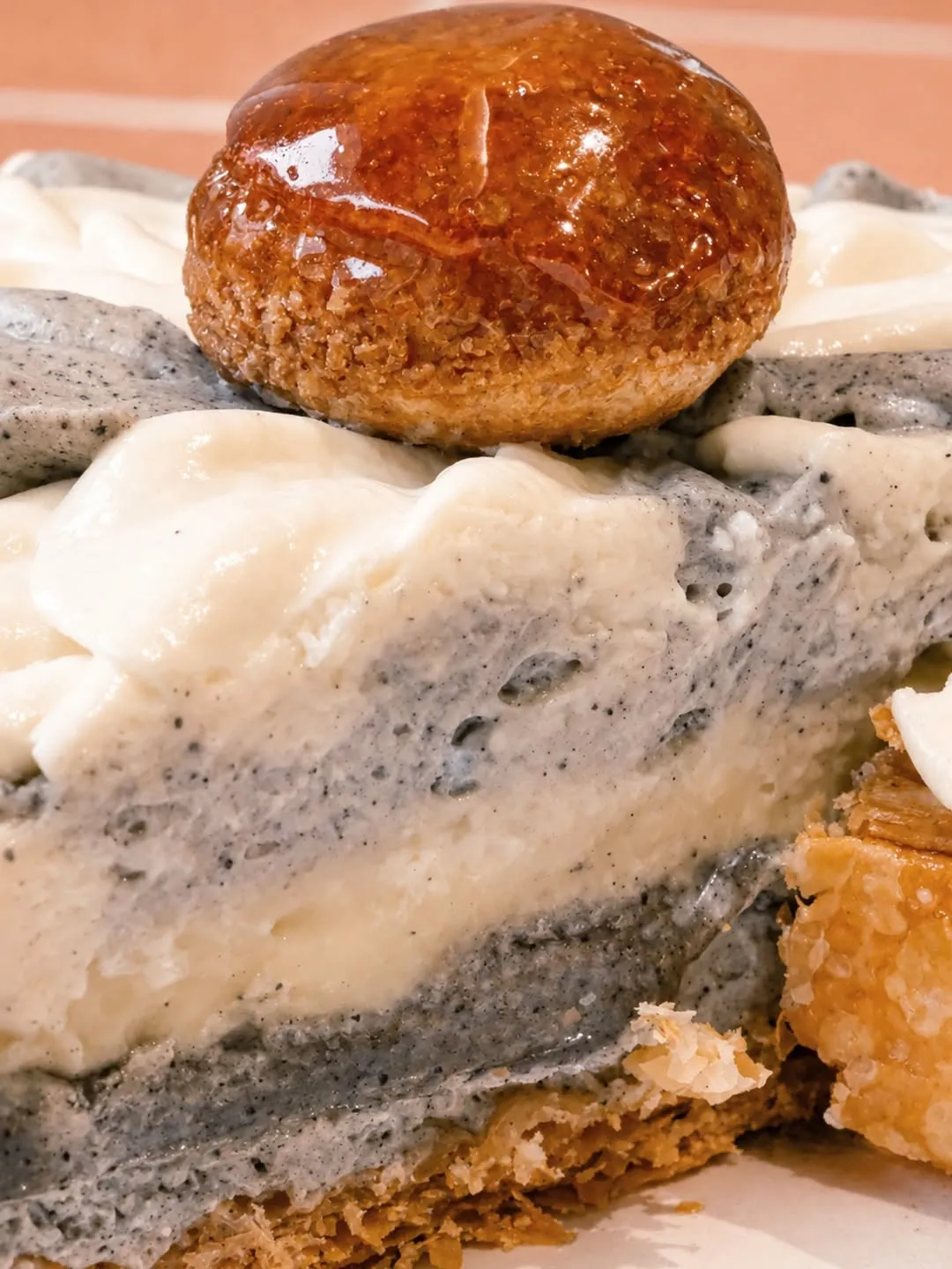 Close-up of mille tart showcasing layers of creamy filling and sesame flavors.