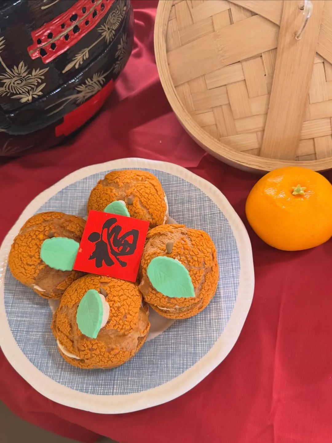 Colorful Chinese New Year pastries on a decorative plate.