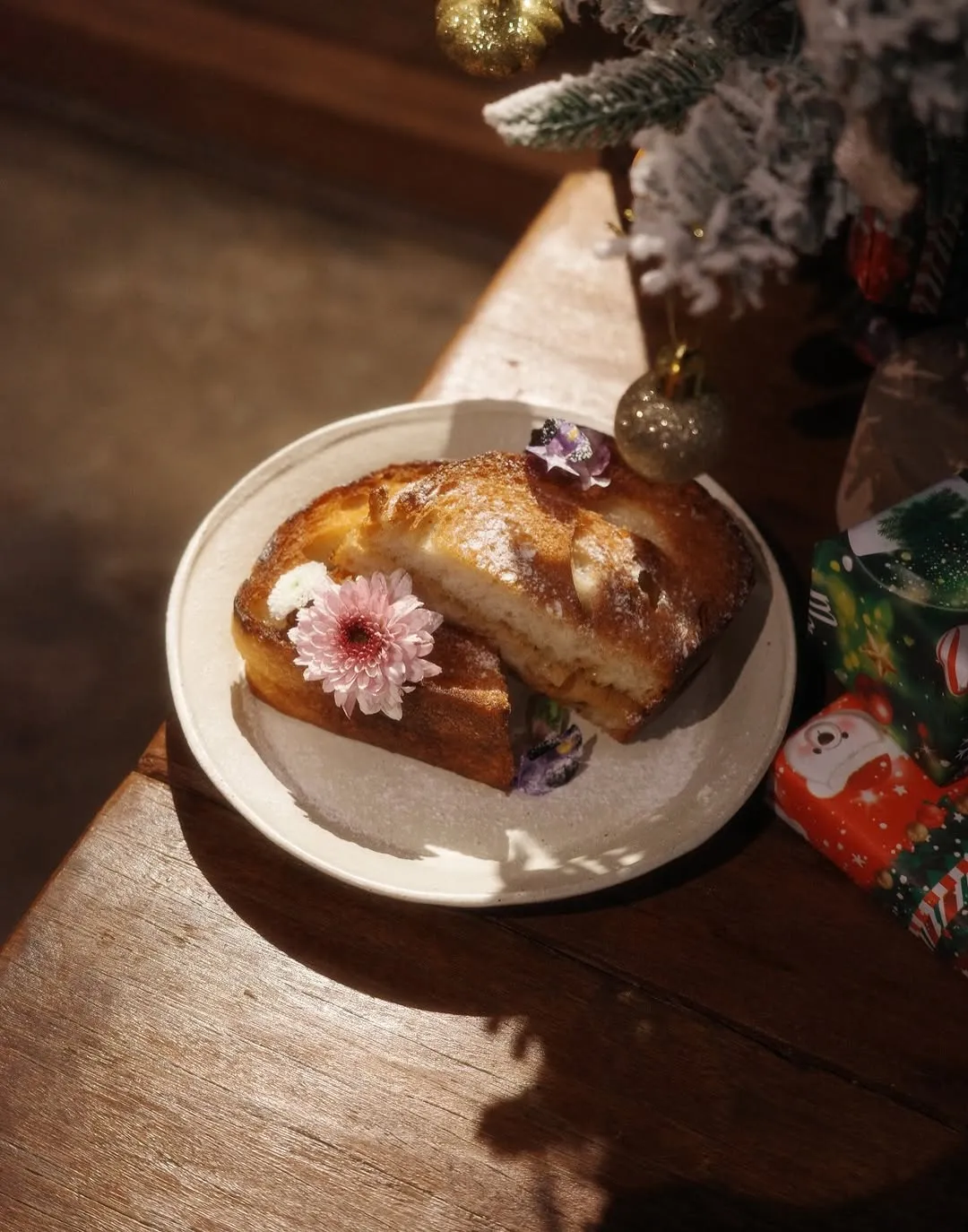 Decadent kaya coffee butter loaf adorned with edible flowers.