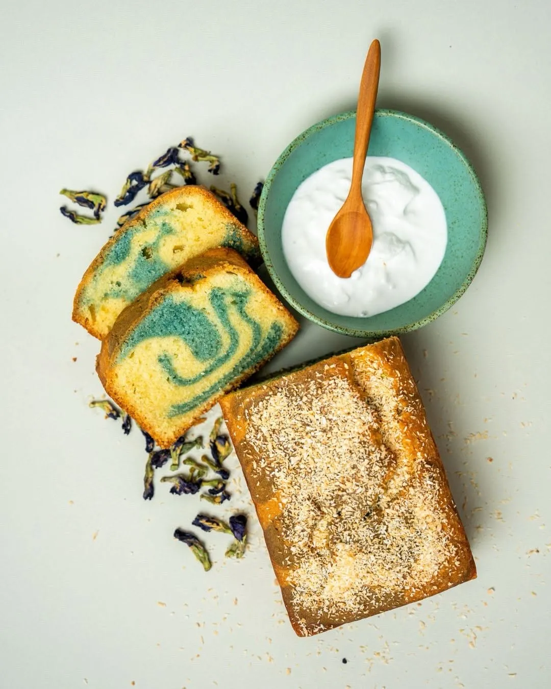 Gooey Onde-Onde cookie beside Bunga Telang Coconut Marble Cake with coconut cream.