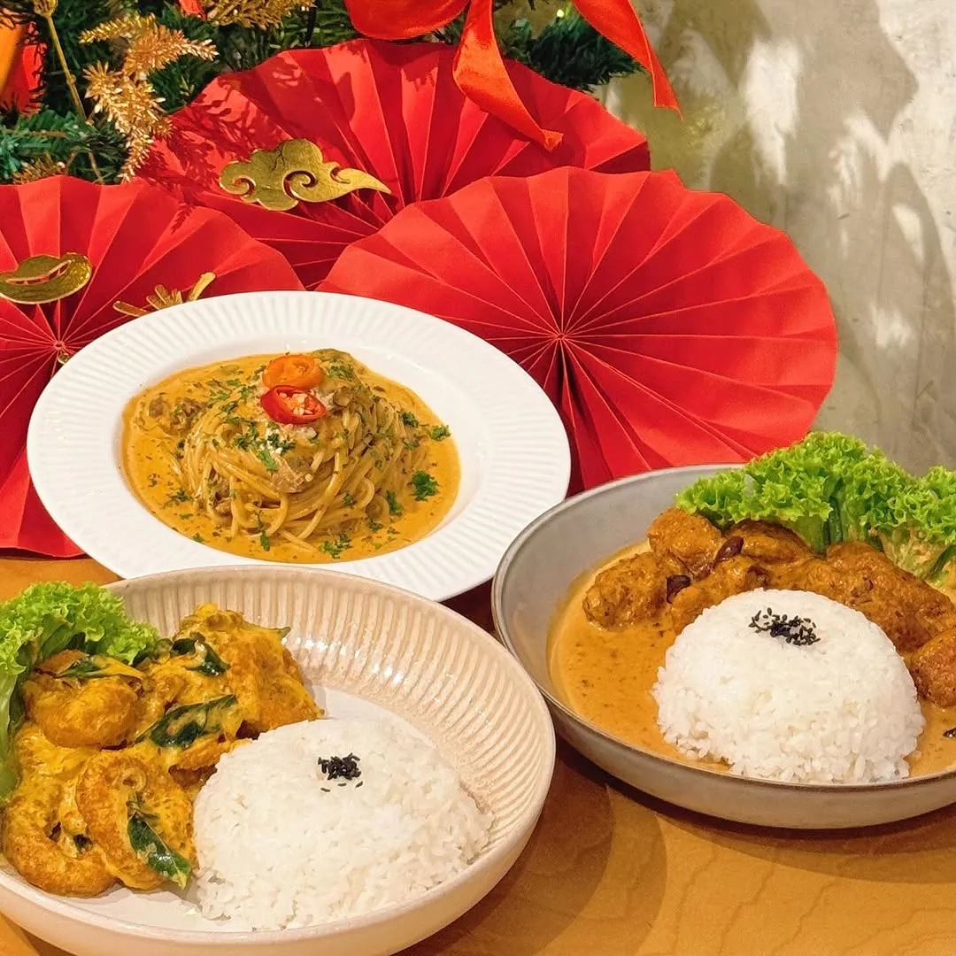 Three dishes for Lunar New Year: creamy pasta, mala chicken, and calamari.
