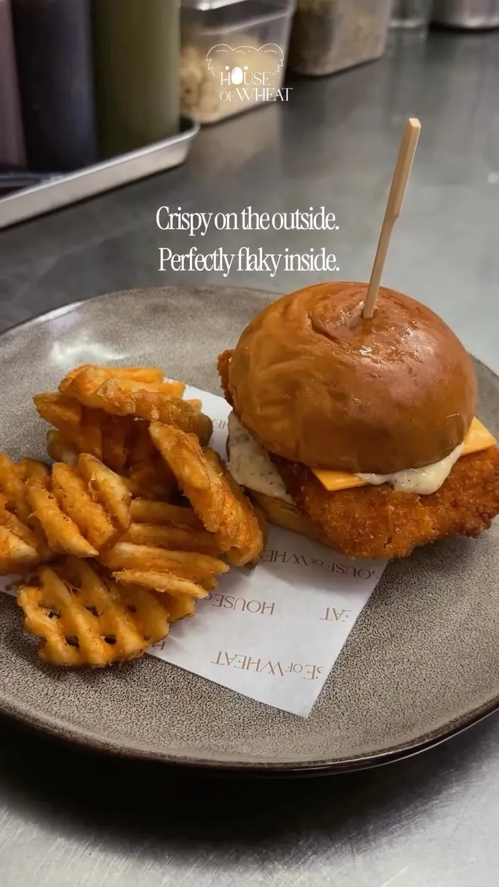 Crispy chicken burger with cheese and signature tartar sauce.