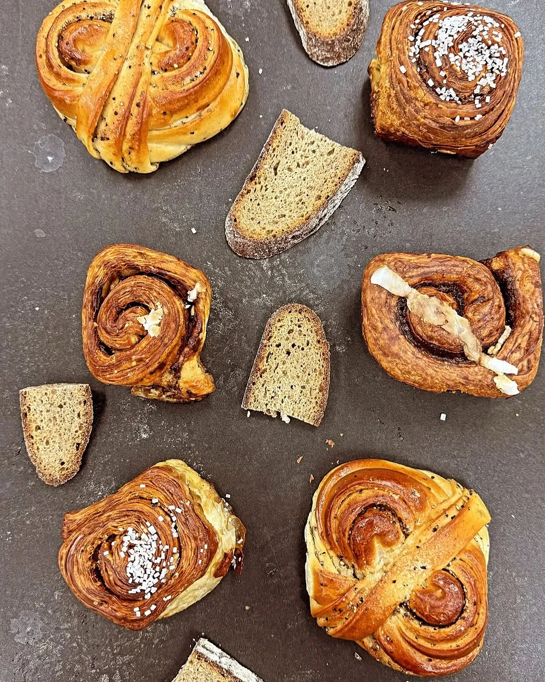 Warmly lit interior showcasing an array of breads and pastries.
