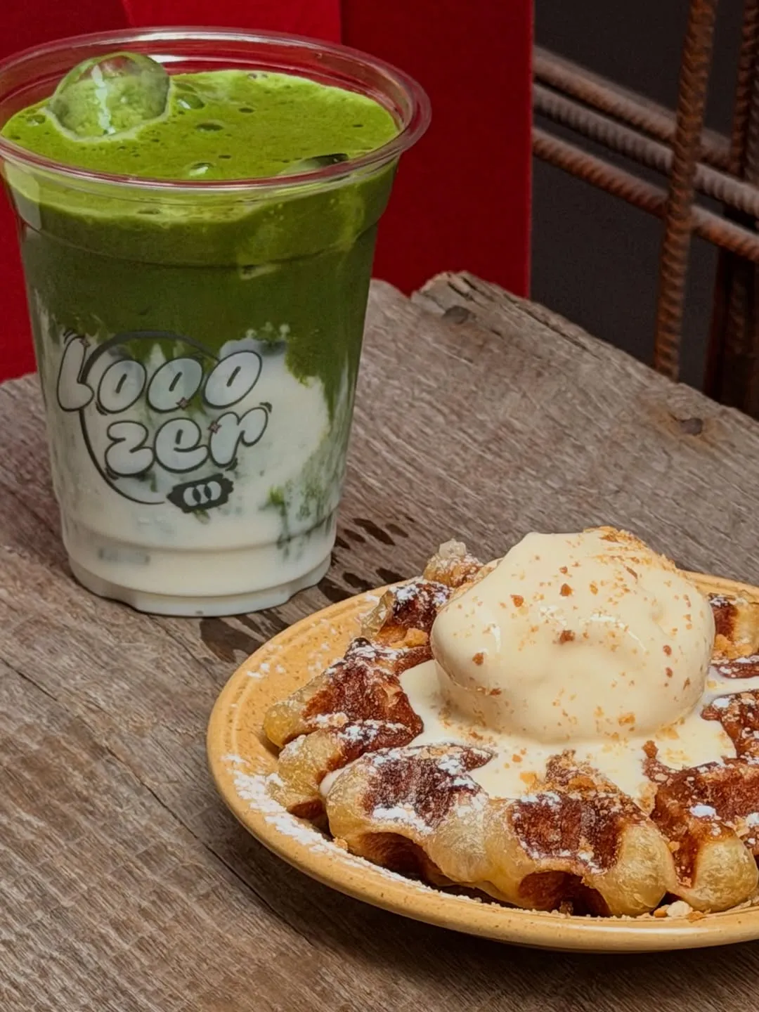 Close-up of Liege waffle with ice cream and matcha drink.